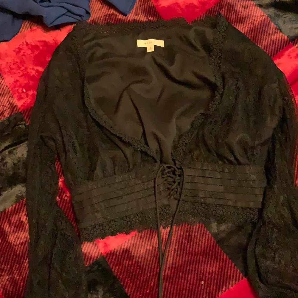 Laced blouse.
